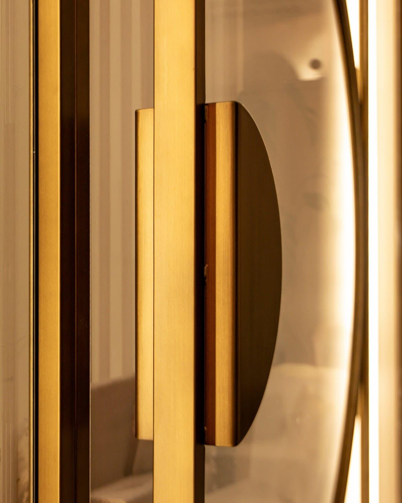 Steel door with golden luna handle and magnetic closure